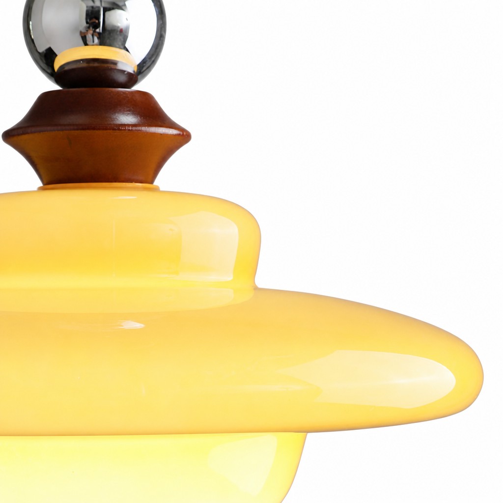 Close-up of glass shade and wood accent
