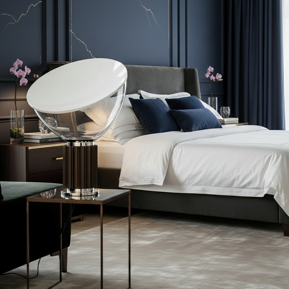 Cuvora table lamp beside a bed